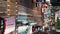 Vertical time lapse of car, bus, taxi traffic transportation, Chinese people, crowd Asian commuter walk cross road at Hong Kong