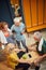 Vertical top shot of four people in gym locker room together enjoying talking before workout