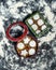 Vertical top view of Christmas metal boxes with cookies inside them