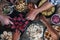 Vertical top view of friends eating together  on a wooden table full of food - friendship and celenration people - concept of