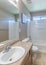 Vertical Traditional bathroom interior with antiqued limestone flooring