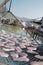 Vertical traditional Hong Kong old wooden house, sun dried fish, boat and river in countryside