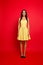 Vertical ull-length view portrait of attractive charming brunette pretty stylish stunning wearing light yellow dotted dress with