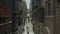 Vertical uplift, drone flying narrow beautiful old street, Valletta, Malta.Old, vintage windows, balconies, people going up stairs