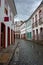 Vertical urban landscape with narrow street, colorful houses and cobbled pavements in Ouro Preto city, Minas Gerais - Brazil. Ouro