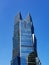 Vertical version of Palm Tower, Doha, Qatar on blue sky background