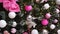 Vertical video, close-up of a Christmas tree with pink decorations