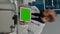 Vertical video: Doctor holding horizontal green screen on digital tablet