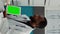 Vertical video: Doctor using greenscreen dispay on digital tablet at checkup