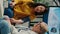 Vertical video: Elderly medic and asian woman doing hypertension measurement