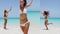 Vertical Video -Sun Vacation travel Excited Woman In Bikini Jumping On Beach