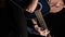 Vertical Video. Young Man Blogger Plays an Acoustic Guitar on a Black Background