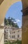 Vertical view of the ancient hilltop village of Cetona, Siena, Italy, framed by an arch