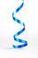 Vertical view of blue curling ribbon for gift wrapping art and crafts on white background