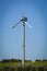 Vertical View of a Broken Wind Turbine on Blue Sky Background