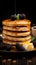 Vertical view captures delectable breakfast croissant, stacked pancakes, cookies on dark table