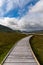 Vertical view of the Claggan Mountain Coastal Trail bog and boardwalk with the Nephir mountain range in the background