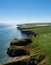 Vertical view of the cliffs and fields on the wild and rugged North Sea shore of Aberdeenshire