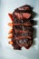vertical view closeup tasty barbecued sliced meat with rice and carrot