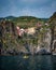 Vertical view of colorful seaside buildings between the slopes in Cinque Terre