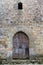 Vertical view of the entrance door to the 15th century Torre de los Velarde, in Santillana del Mar, Spain,