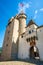 Vertical view of entrance gate and tower of Aigle castle in Switzerland