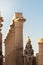 Vertical view of the entrance of luxor temple in Egypt. Clear blue sky with big cloumns and statue in egyptian