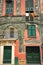 Vertical View of the Facade of an Ancient Coloured Building.