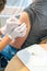 Vertical view of a female doctor disinfecting a female patient`s arm after a vaccination