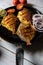 Vertical view of grilled fish along with condiments