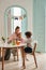 Vertical view of the little multiracial boys playing with kinetic sand at home