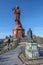 Vertical view of Notre Dame de France monument in the top of Corneille Rock, the monument of bishop Auguste de Morlhon is at