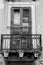 Vertical View of an Old Balcony With a Broken and Walled Up Wood