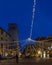 Vertical view of the Piazza della Cisterna square, historic center of San Gimignano, Siena, Italy, with the lights of dusk