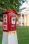 Vertical view of a red and white callbox, also know as a fire alarm box or fire alarm pull