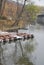 Vertical view of the river flooding on a rainy day - toy cars at the edge of the riverbank