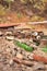 Vertical view of a ruined wall formed by waste materials