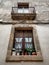Vertical view of rustic windows and balcony