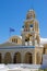 Vertical view of Saint Georgios Oia Holy Orthodox Church before a blue skyline