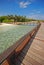 Vertical View of Spacious Wooden Walkway on an Island Paradise