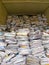 Vertical view of  stacks of paper and magazines and newspapers ready to be recycled