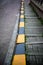 Vertical View Of a Stoned Stair Along The Street With Black and