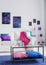 Vertical view of stylish living room with comfortable white couch with pink blanket and blue and purple pillows, cosmos graphics o