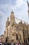Vertical view of tourists visiting the front exterior of Romanesque and Gothic St. Stephen\\\'s Cathedral