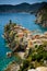 Vertical View of the Town of Vernazza on blue Sea and the Coastline of the Liguria Background.