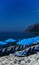 Vertical vivid beach blue umbrellas bokeh