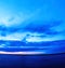 Vertical vivid super wide angle ocean curved horizon with clouds