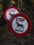 Vertical warning signs of horses passing by saying: `Stop, thank you` in spanish.