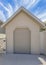 Vertical Whispy white clouds Tool shed with clipped edge entrance and sectional door