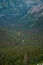 vertical wide capture of alpine landscape with a river running through the middle of the frame